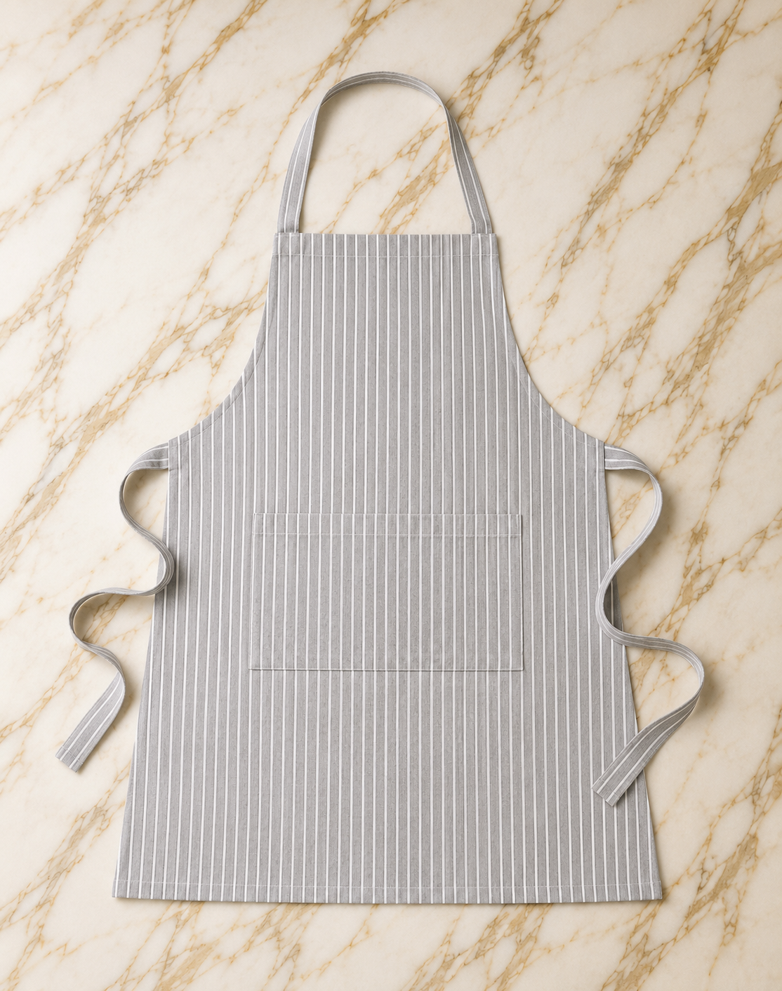 Striped apron on a marble surface