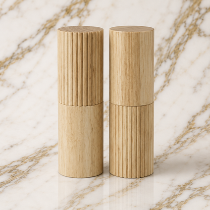 Wooden salt and pepper shakers on a marble surface